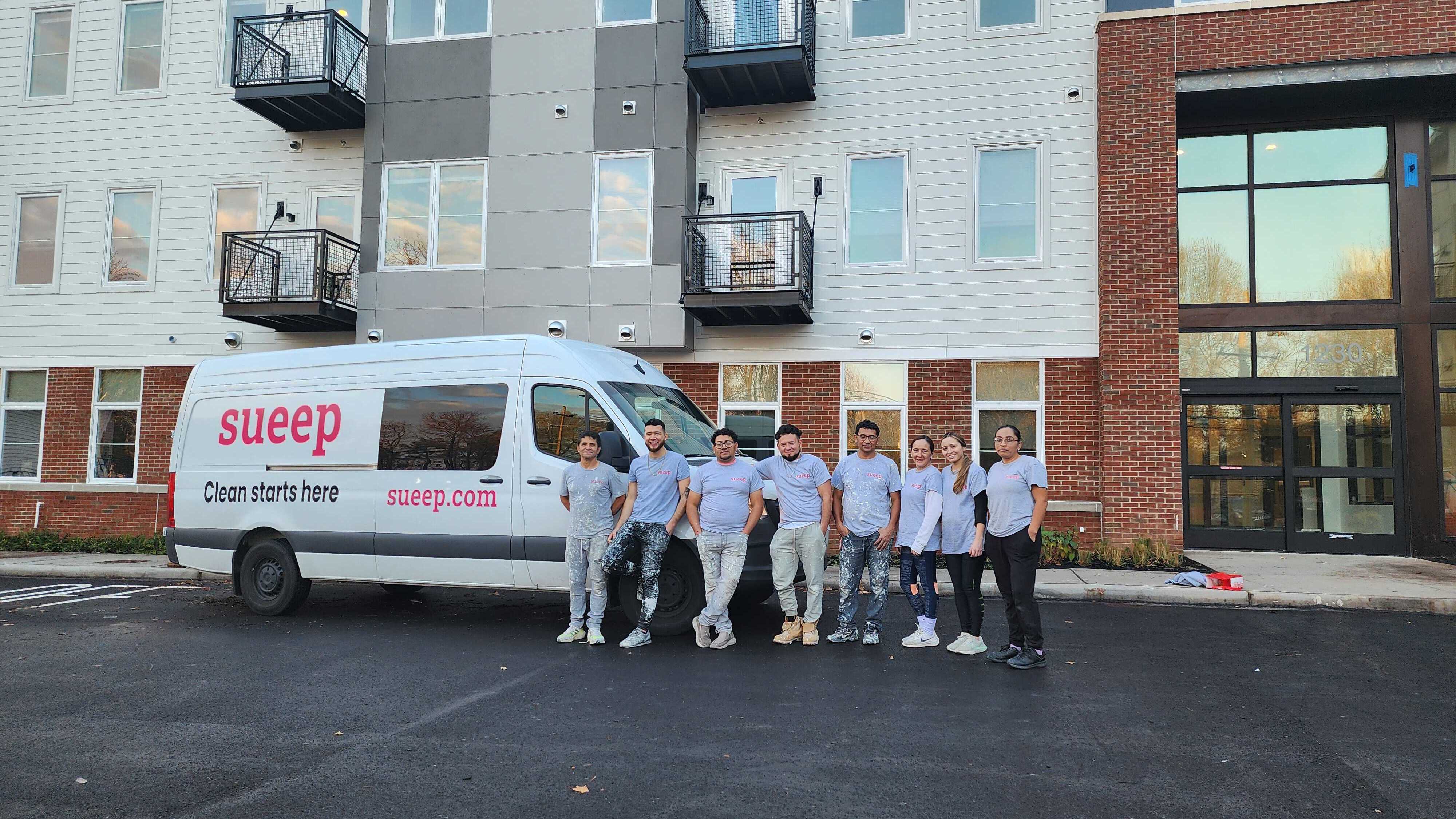 Sueep team with van outside residential building